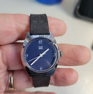 Ladies Q&Q watch blue face black band, manual wind